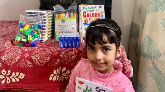 Mrs Anita donated 100 drawing books, colours and warm clothes